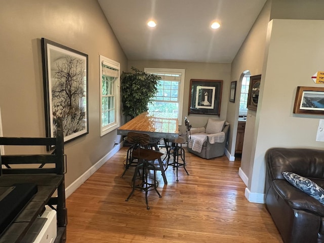 500 N Grant St, Westmont, IL 60559 - dining space featuring vaulted ceiling, light wood-style floors, recessed lighting, and arched walkways