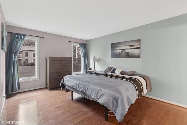 1521 S County Farm Rd Unit 1-3C, Wheaton, IL 60189 - bedroom with baseboards and wood finished floors