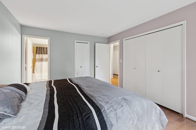 1521 S County Farm Rd Unit 1-3C, Wheaton, IL 60189 - bedroom with multiple closets and light wood-style floors