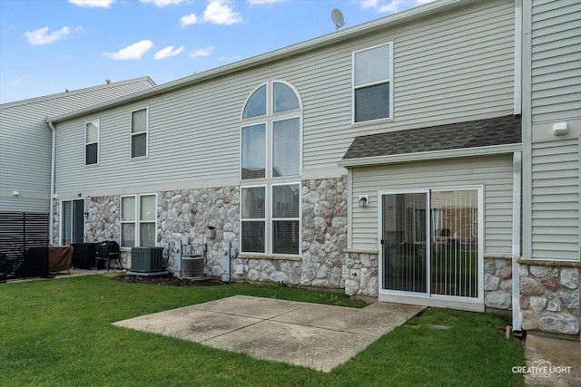 24825 W Gates Ct, Plainfield, IL 60585 - back of property featuring stone siding, a lawn, and a patio
