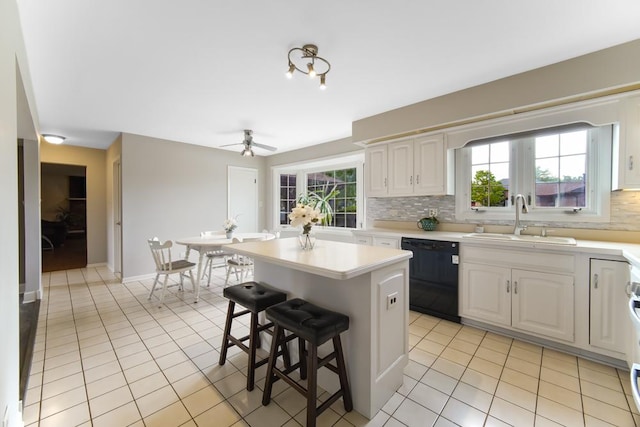 12850 S Westport Dr, Palos Park, IL 60464 - kitchen featuring dishwasher, light tile patterned floors, tasteful backsplash, and light countertops