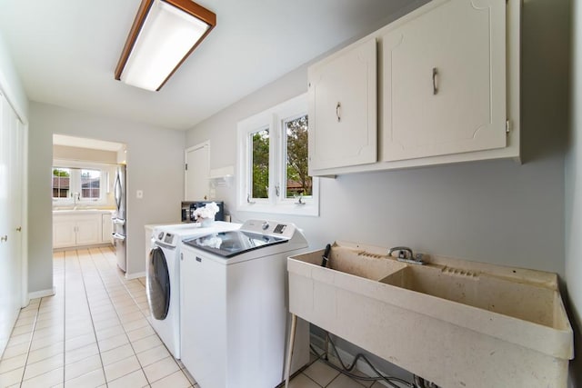 12850 S Westport Dr, Palos Park, IL 60464 - laundry room featuring washing machine and dryer, cabinet space, and light tile patterned floors
