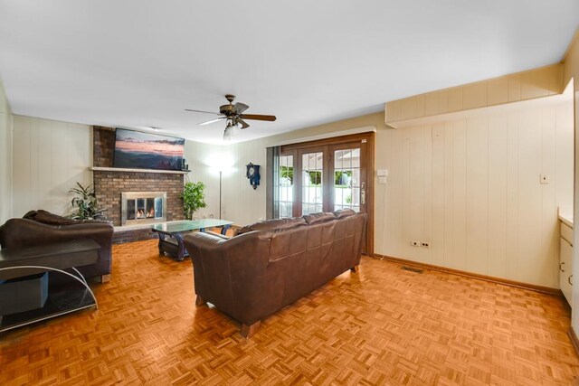 12850 S Westport Dr, Palos Park, IL 60464 - living area with a fireplace, a ceiling fan, and wooden walls