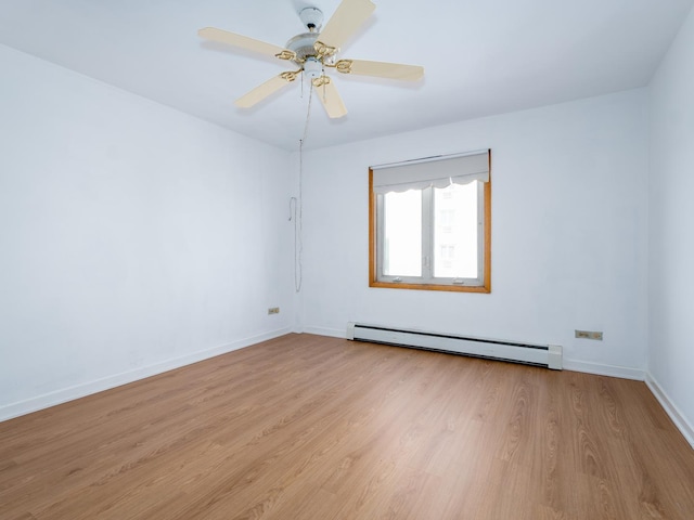 8005 W Oconnor Dr Unit 4E, River Grove, IL 60171 - empty room featuring a baseboard heating unit, light wood-type flooring, and ceiling fan
