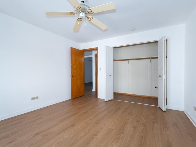 8005 W Oconnor Dr Unit 4E, River Grove, IL 60171 - unfurnished bedroom with wood finished floors, a closet, and ceiling fan