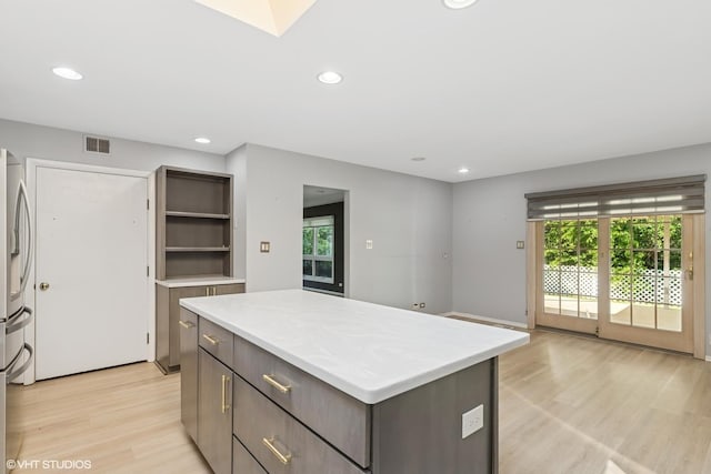 3071 Plum Island Dr, Northbrook, IL 60062 - kitchen featuring a center island, light wood finished floors, light countertops, recessed lighting, and stainless steel refrigerator with ice dispenser
