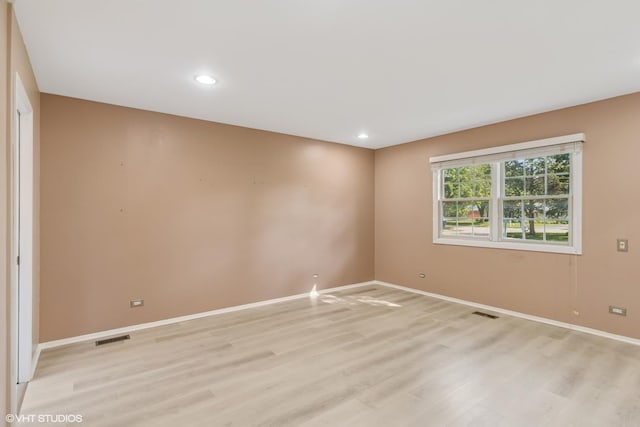 3071 Plum Island Dr, Northbrook, IL 60062 - unfurnished room with light wood-style floors and recessed lighting
