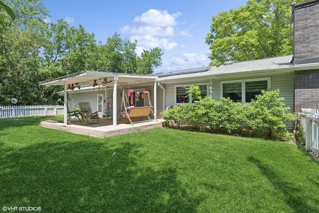 3071 Plum Island Dr, Northbrook, IL 60062 - back of property featuring roof mounted solar panels, a chimney, and a patio area