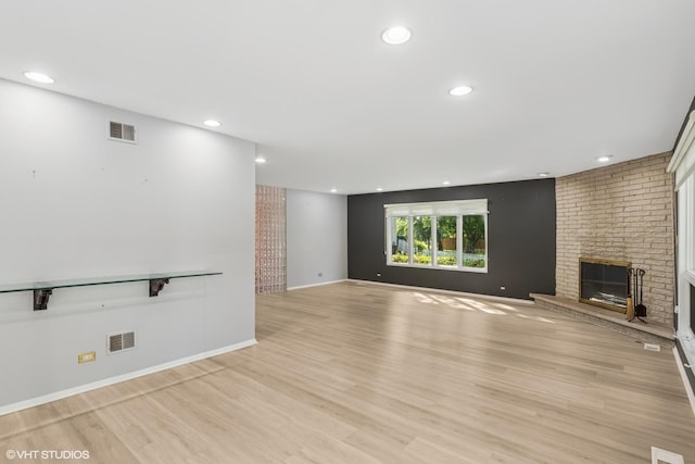 3071 Plum Island Dr, Northbrook, IL 60062 - unfurnished living room with light wood-style floors, a fireplace, and recessed lighting