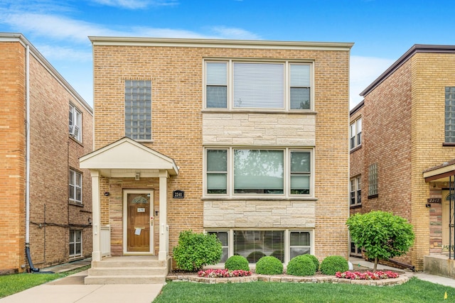 2241 S 17th Ave, North Riverside, IL 60546 - view of property with stone siding, brick siding, and a front yard