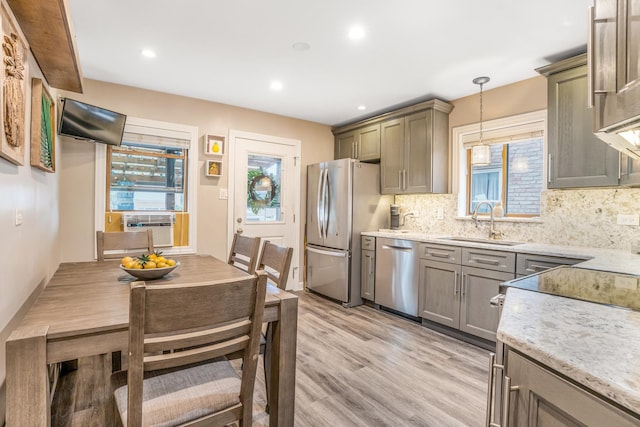 2241 S 17th Ave, North Riverside, IL 60546 - kitchen with stainless steel appliances, backsplash, light wood finished floors, healthy amount of natural light, and recessed lighting