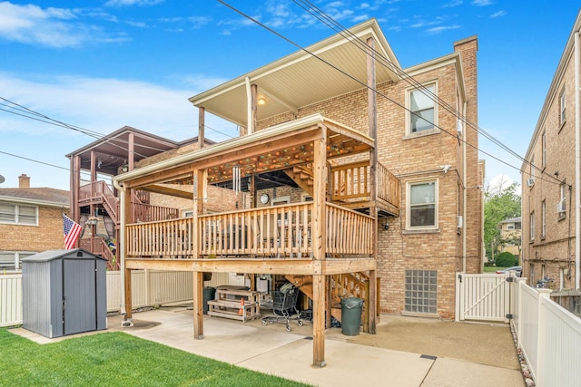2241 S 17th Ave, North Riverside, IL 60546 - back of property featuring a storage shed, brick siding, a patio area, and a fenced backyard