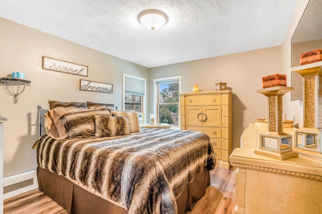 2241 S 17th Ave, North Riverside, IL 60546 - bedroom featuring light wood finished floors and a textured ceiling