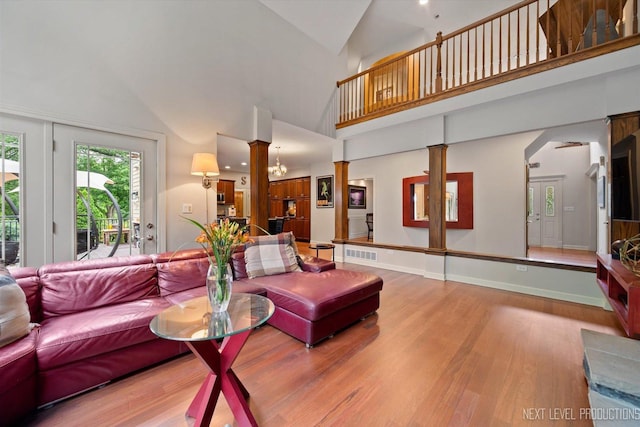 7N107 Hastings Dr, Saint Charles, IL 60175 - living area with decorative columns, wood finished floors, and lofted ceiling