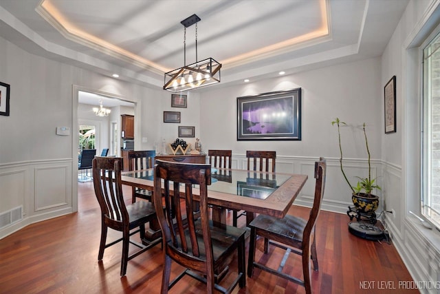7N107 Hastings Dr, Saint Charles, IL 60175 - dining area featuring a tray ceiling, a chandelier, a decorative wall, wood finished floors, and recessed lighting