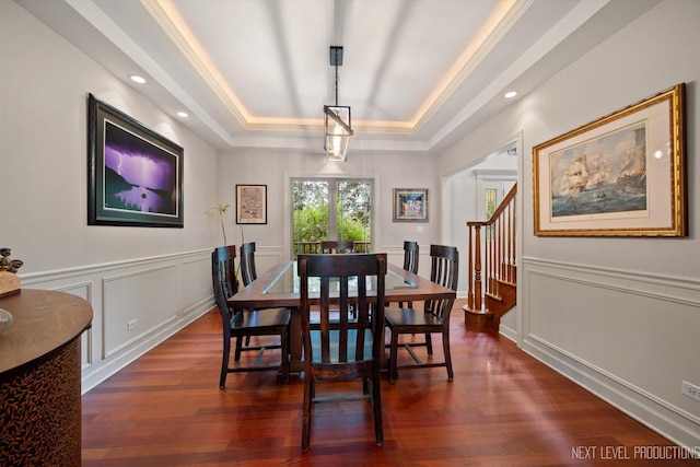 7N107 Hastings Dr, Saint Charles, IL 60175 - dining space with a raised ceiling, dark wood finished floors, stairway, a decorative wall, and wainscoting