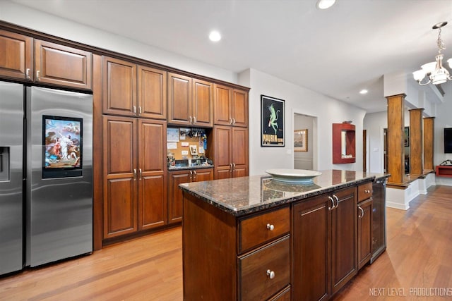 7N107 Hastings Dr, Saint Charles, IL 60175 - kitchen with stainless steel refrigerator with ice dispenser, light wood-style floors, dark stone counters, a center island, and a chandelier
