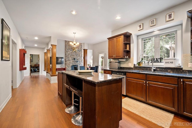 7N107 Hastings Dr, Saint Charles, IL 60175 - kitchen with open shelves, a center island, wood finished floors, a chandelier, and dishwasher