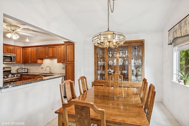 1508 Seville Ct Unit D2, Wheeling, IL 60090 - dining area featuring a chandelier, lofted ceiling, ceiling fan, and light colored carpet