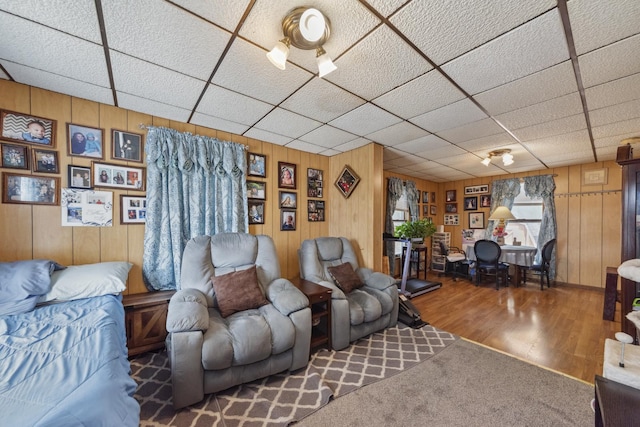 525 Munroe St, Joliet, IL 60436 - living area featuring a paneled ceiling, wood finished floors, and wooden walls