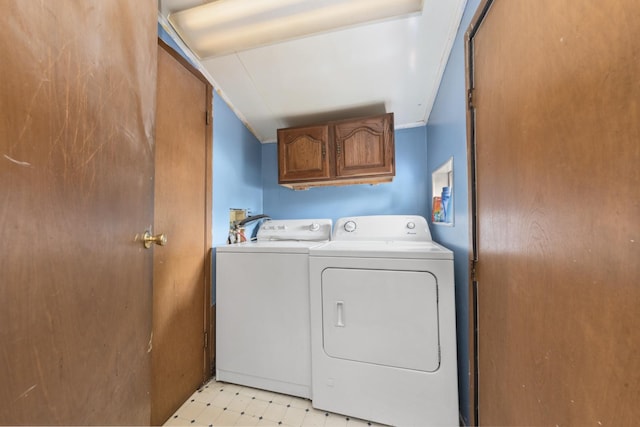 525 Munroe St, Joliet, IL 60436 - washroom featuring washer and clothes dryer, cabinet space, and light flooring