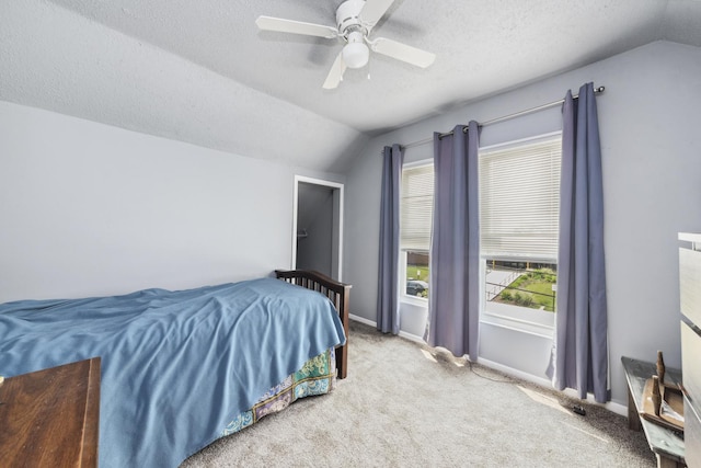 525 Munroe St, Joliet, IL 60436 - unfurnished bedroom featuring vaulted ceiling, multiple windows, carpet, a textured ceiling, and a ceiling fan