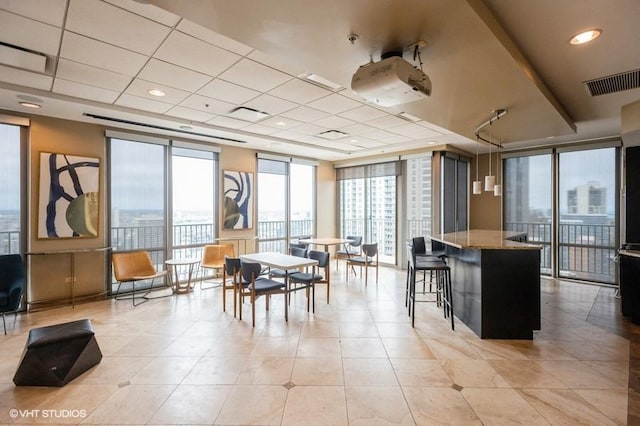 2 E Erie St Unit 3106, Chicago, IL 60611 - dining room featuring a wall of windows, light tile patterned floors, and a drop ceiling