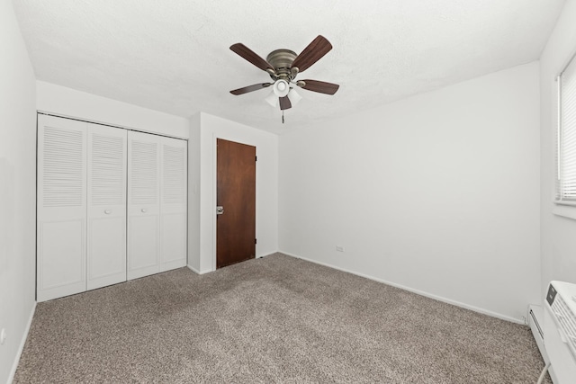 1320 Lore Ln Unit 2-201, Lombard, IL 60148 - unfurnished bedroom with carpet flooring, a closet, a ceiling fan, and a baseboard radiator