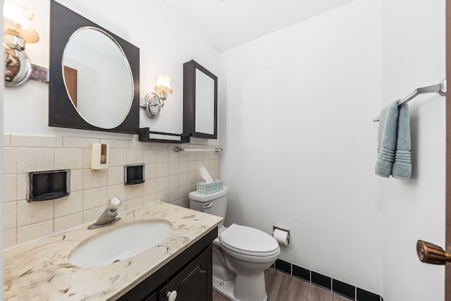1320 Lore Ln Unit 2-201, Lombard, IL 60148 - bathroom with vanity, wood finished floors, and decorative backsplash