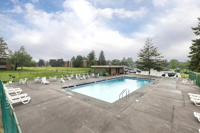 1320 Lore Ln Unit 2-201, Lombard, IL 60148 - community pool featuring a patio