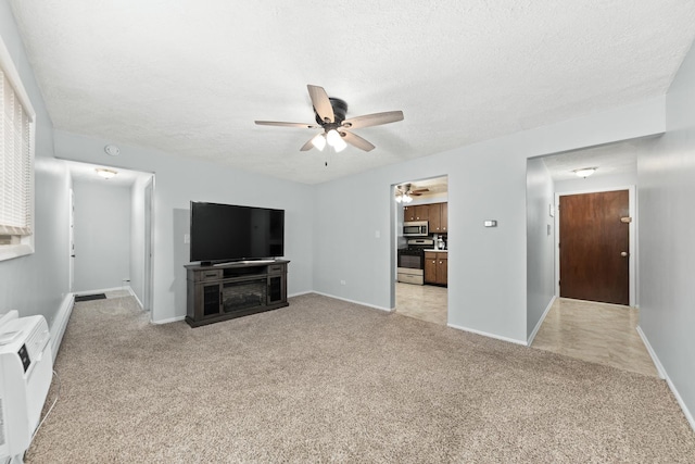1320 Lore Ln Unit 2-201, Lombard, IL 60148 - unfurnished living room with ceiling fan, light carpet, and a textured ceiling