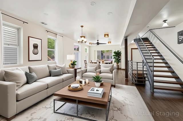 1940 S Racine Ave, Chicago, IL 60608 - living room with wood finished floors, healthy amount of natural light, stairs, and a chandelier