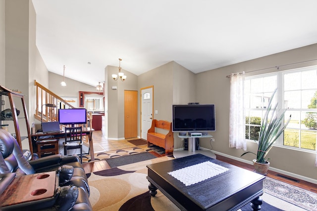 21023 Siegel Dr, Crest Hill, IL 60403 - living area featuring vaulted ceiling, stairway, and a chandelier