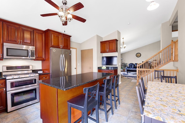 21023 Siegel Dr, Crest Hill, IL 60403 - kitchen featuring stainless steel appliances, a center island, ceiling fan, a kitchen bar, and lofted ceiling