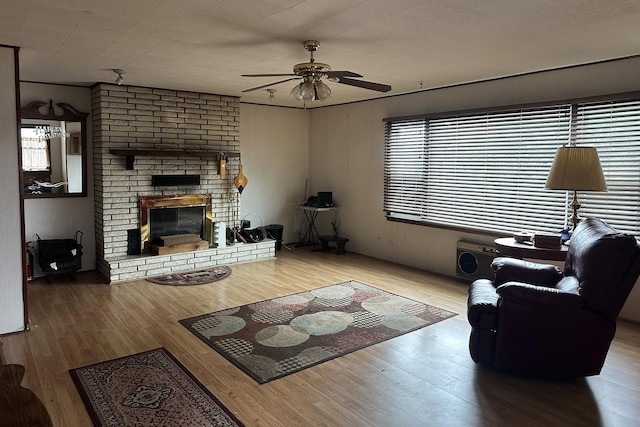 115 Country Club Dr, Northlake, IL 60164 - living room featuring a ceiling fan, wood finished floors, and a brick fireplace