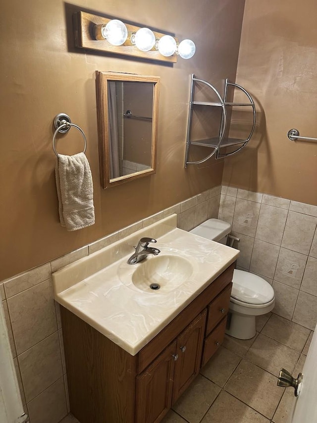115 Country Club Dr, Northlake, IL 60164 - bathroom with tile walls, vanity, wainscoting, and tile patterned flooring