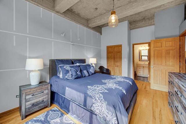 6135 N Broadway St Unit 303, Chicago, IL 60660 - bedroom featuring light wood-type flooring and ensuite bathroom