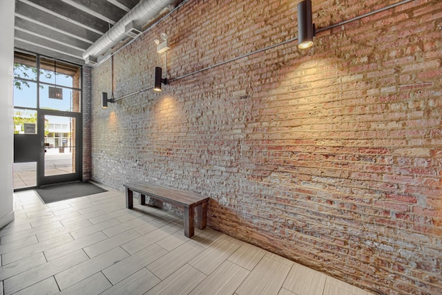 6135 N Broadway St Unit 303, Chicago, IL 60660 - building lobby with a towering ceiling and brick wall