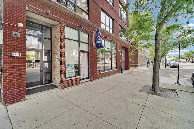 6135 N Broadway St Unit 303, Chicago, IL 60660 - doorway to property with brick siding