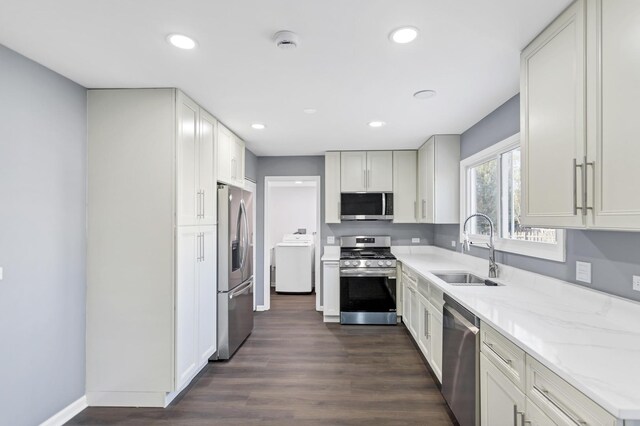 8 Cheswick Ct, Schaumburg, IL 60194 - kitchen with appliances with stainless steel finishes, washer / dryer, dark wood-type flooring, recessed lighting, and light stone countertops