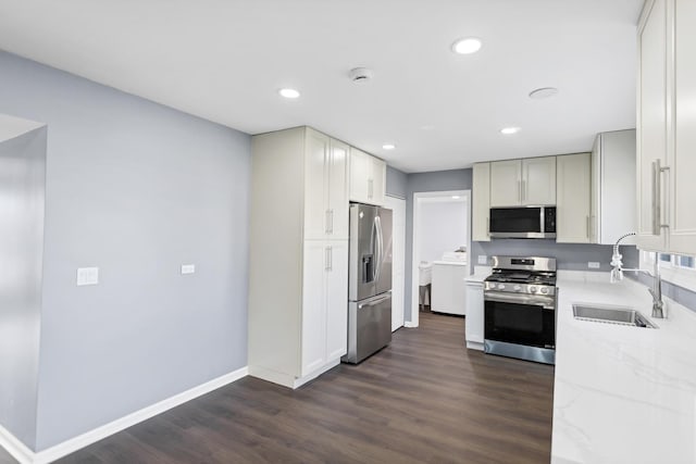 8 Cheswick Ct, Schaumburg, IL 60194 - kitchen with stainless steel appliances, washer / clothes dryer, light stone counters, dark wood-style floors, and recessed lighting