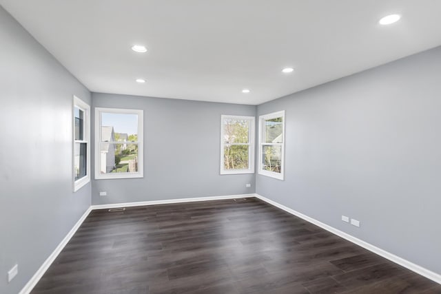 8 Cheswick Ct, Schaumburg, IL 60194 - empty room with plenty of natural light, recessed lighting, and dark wood-style flooring
