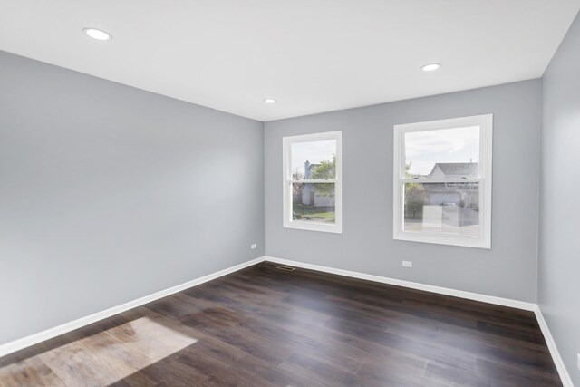 8 Cheswick Ct, Schaumburg, IL 60194 - empty room with dark wood-style floors and recessed lighting