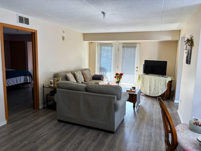 231 N Mill Rd Unit 11, Addison, IL 60101 - living room with wood finished floors and a textured ceiling