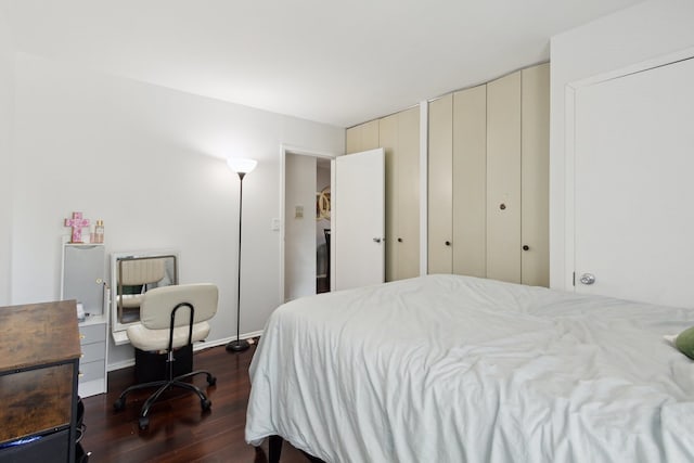907 S Williams St Unit 206, Westmont, IL 60559 - bedroom with dark wood-style flooring, two closets, and an office area