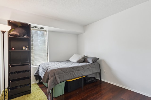 907 S Williams St Unit 206, Westmont, IL 60559 - bedroom with wood finished floors and a textured ceiling