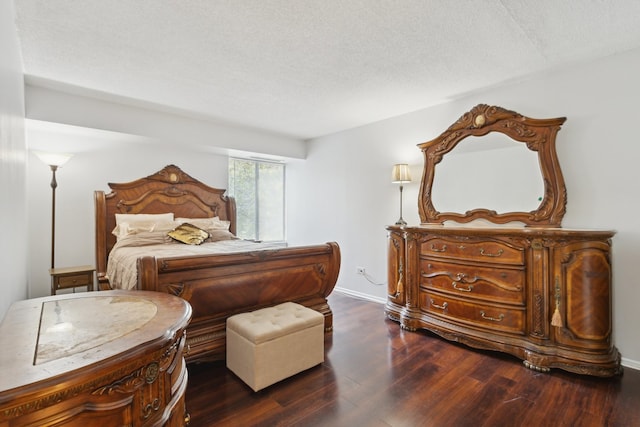 907 S Williams St Unit 206, Westmont, IL 60559 - bedroom featuring dark wood finished floors and a textured ceiling