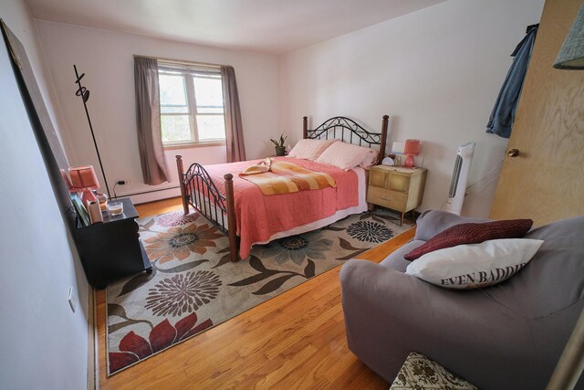6101 N Elston Ave Unit 3E, Chicago, IL 60646 - bedroom with wood finished floors and a baseboard heating unit