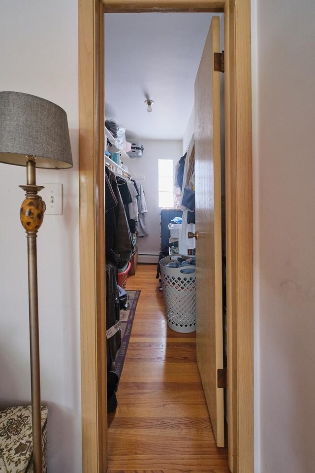 6101 N Elston Ave Unit 3E, Chicago, IL 60646 - hall with wood finished floors and a baseboard radiator