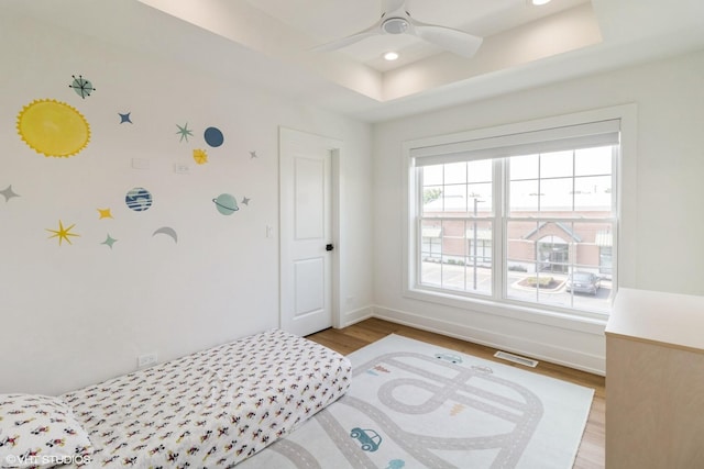 1 N Beverly Ln, Arlington Heights, IL 60004 - bedroom with light wood-type flooring, recessed lighting, ceiling fan, and a raised ceiling